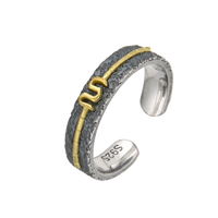 [full] Silver and gold ring on a white background