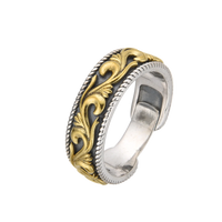 [full] Silver and gold ring with intricate design on a white background