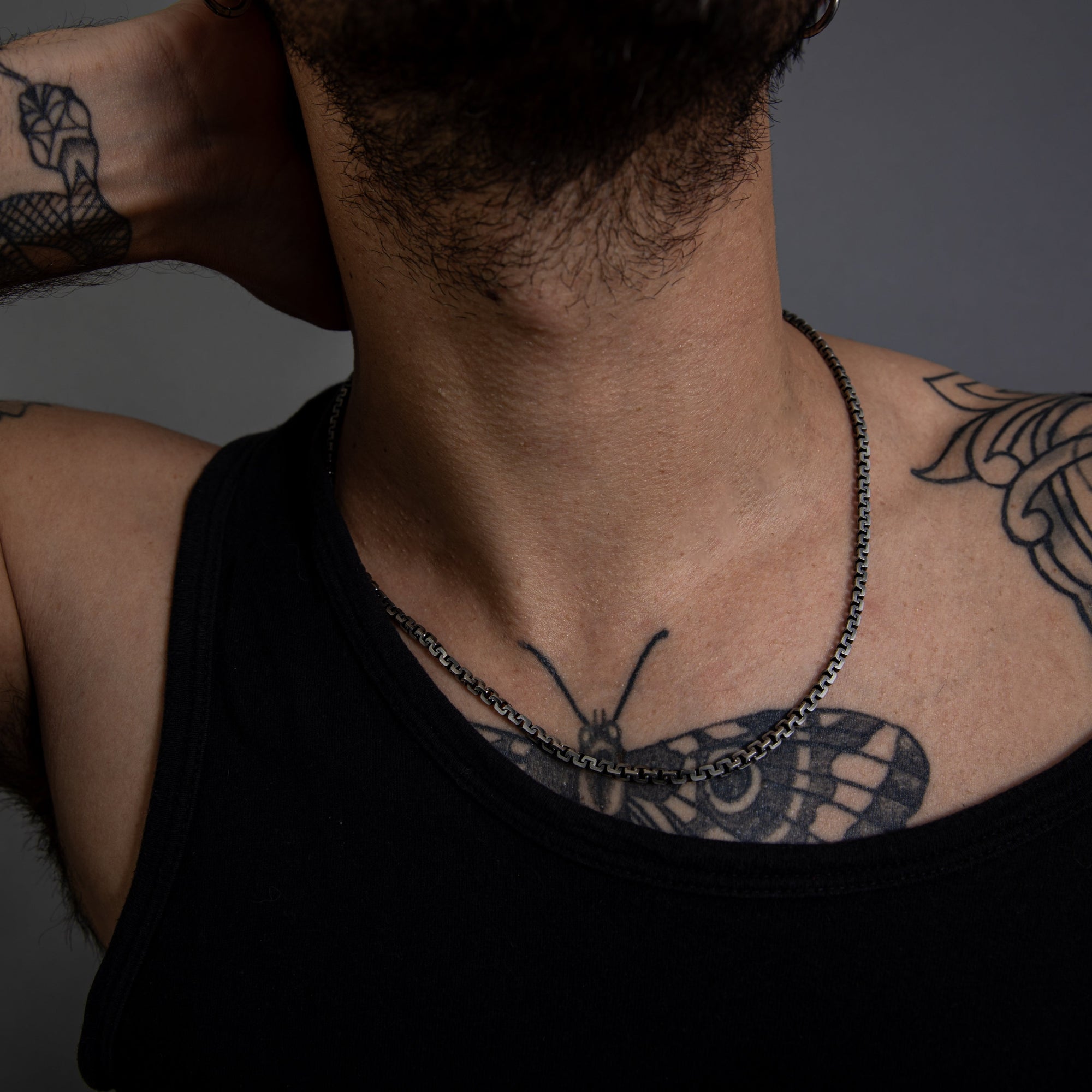 [full] - Person with tattoos wearing sterling silver with ruthenium necklace