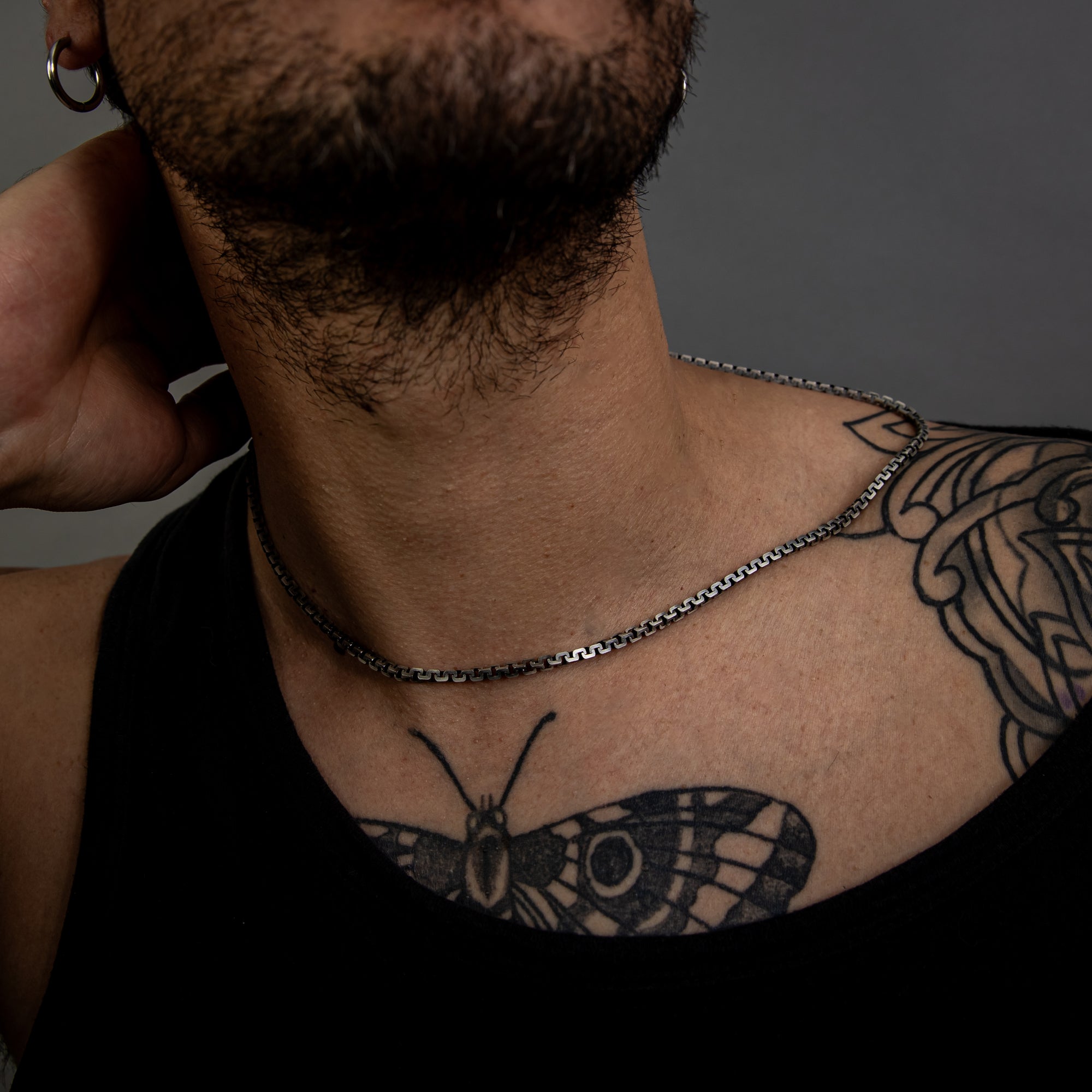 [full] - Person with tattoos wearing sterling silver with ruthenium necklace