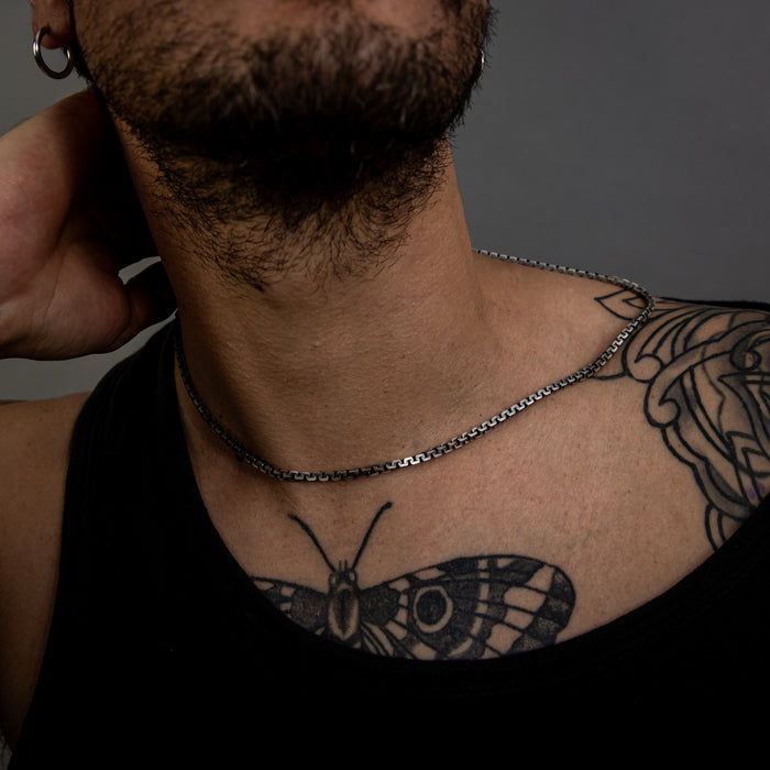 [full] - Person with tattoos wearing sterling silver with ruthenium necklace