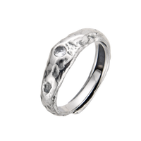 [full] Silver ring with a textured surface on a white background