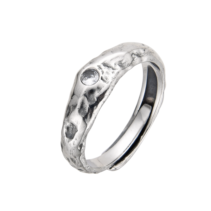 [full] Silver ring with a textured surface on a white background