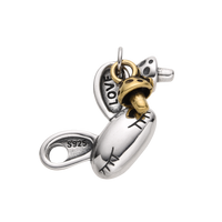 [full] - Sterling silver bone pendant with gold-tone mushroom charm and stitch engraving.