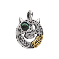 [full]- Sterling silver smiley face pendant with multicolor eye and gold-tone accent.
