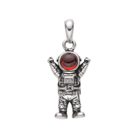 [full] Naut sterling silver pendant with an astronaut figure and red gemstone helmet.