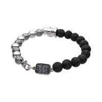 [full] - Black lava stone and sterling silver bead bracelet with contrasting textures.