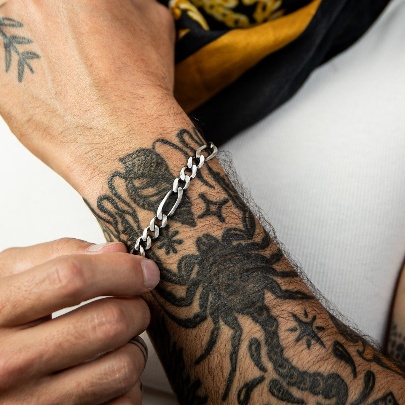 [full] - Close-up of a gun-metal sterling silver bracelet with a brushed finish.