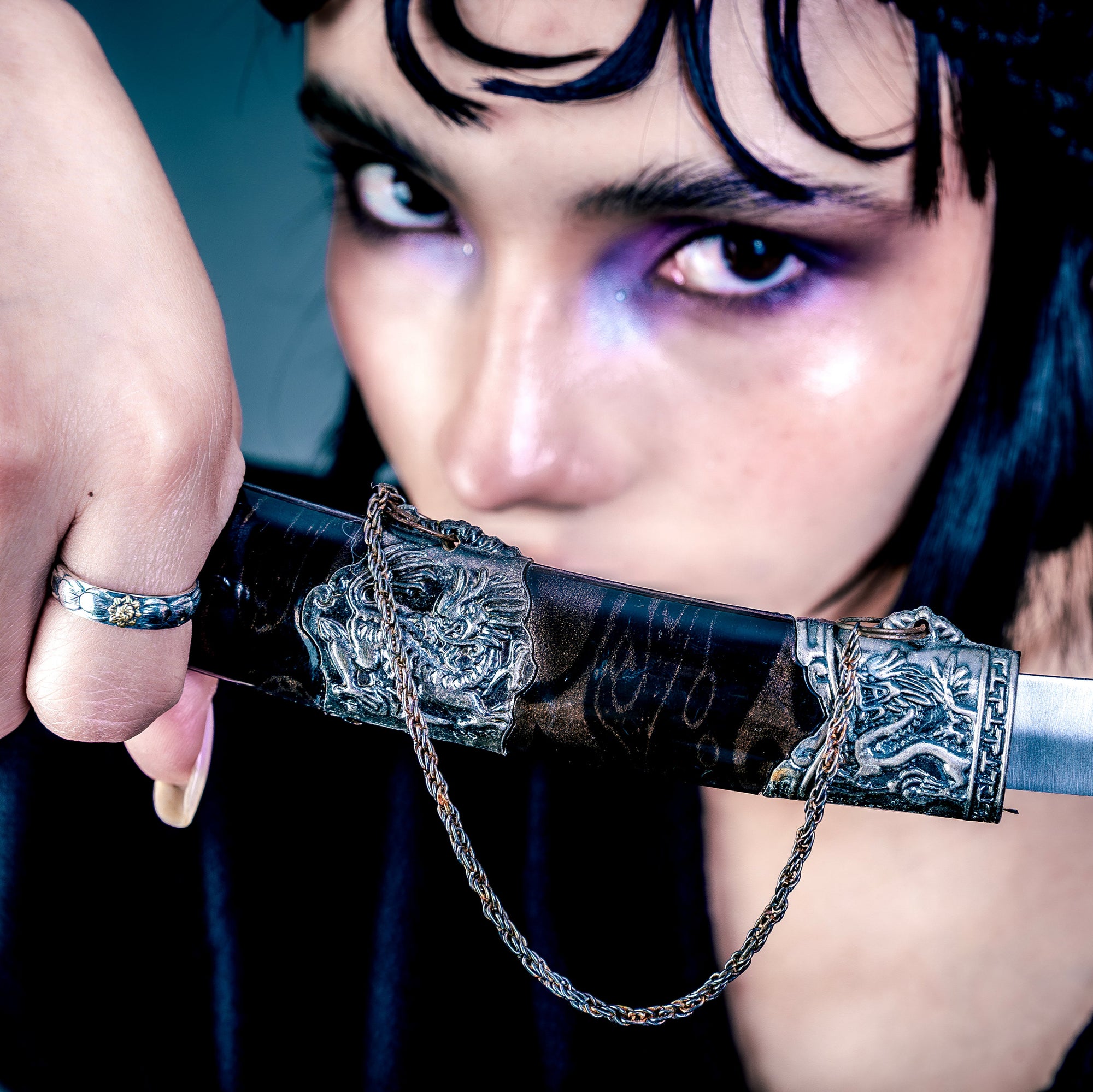 [full] - person holding a sword, wearing a sterling silver ring