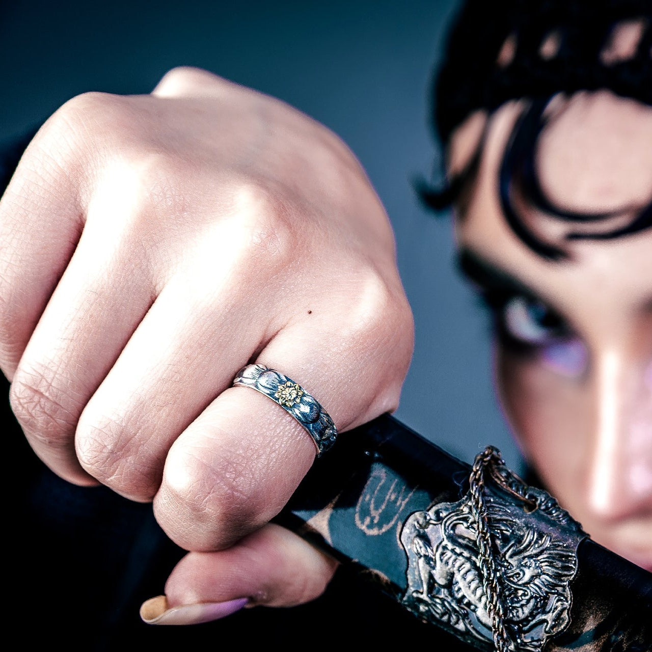 [full] - person holding a sword, wearing a sterling silver ring