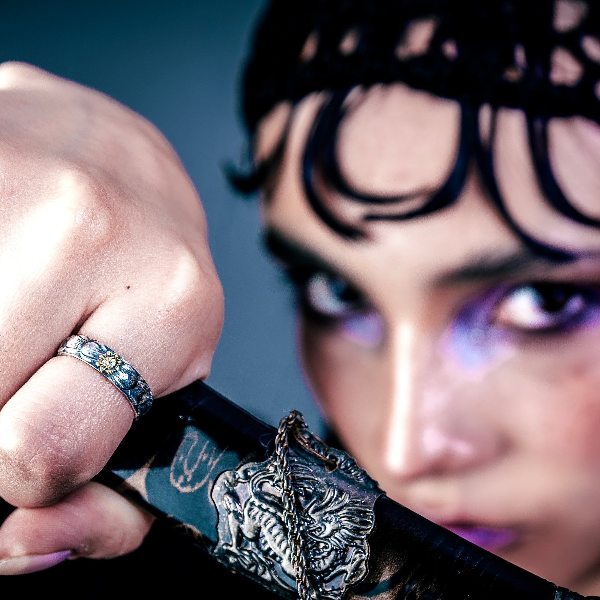 [full] - person holding a sword, wearing a sterling silver ring