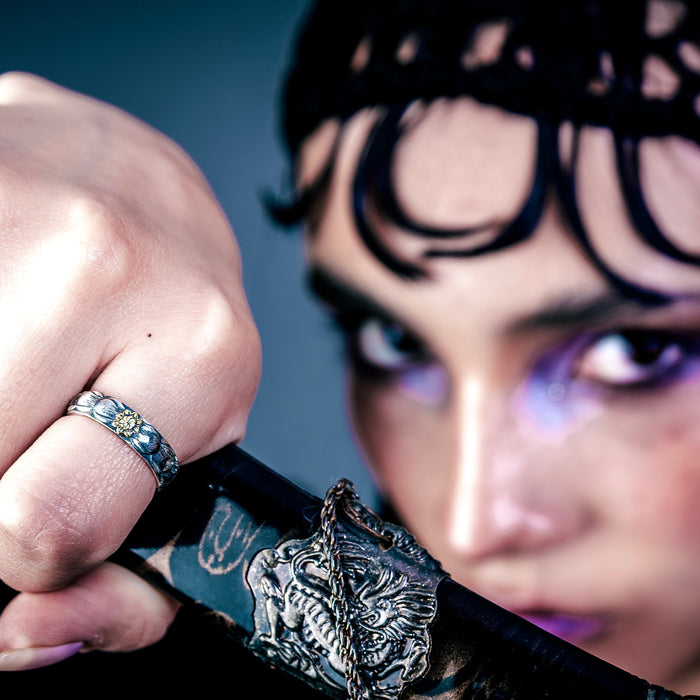 [full] - person holding a sword, wearing a sterling silver ring