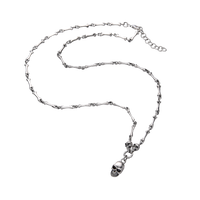 [full] - Sterling silver necklace with bone-shaped links and a detailed skull pendant.