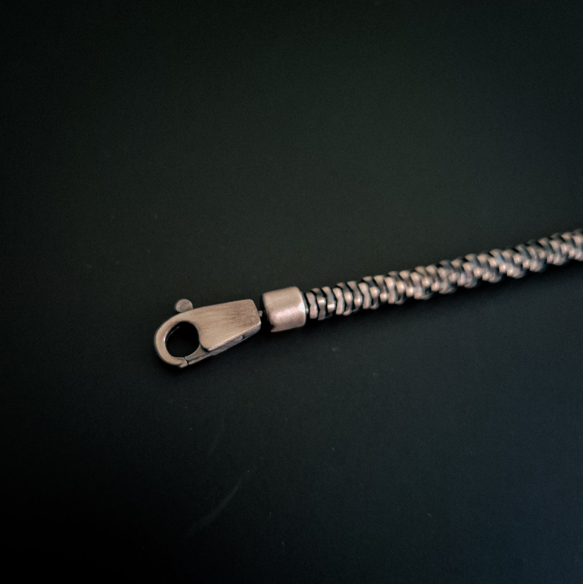 [full] - Mirror-snake design sterling silver bracelet with dark gun-metal ruthenium plating and seamless clasp.