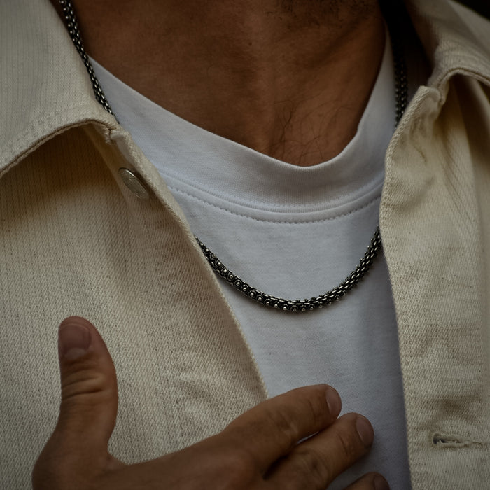 [full]- Handmade sterling silver necklace, with textured, organic-shaped links inspired by the Pikun flower.