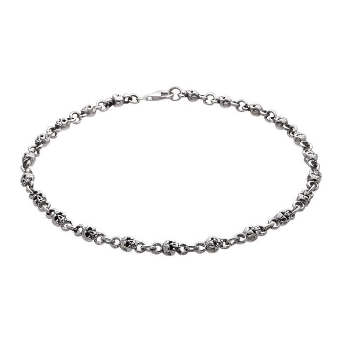 [full] - Sterling silver skull link bracelet with oxidised details and polished highlights.