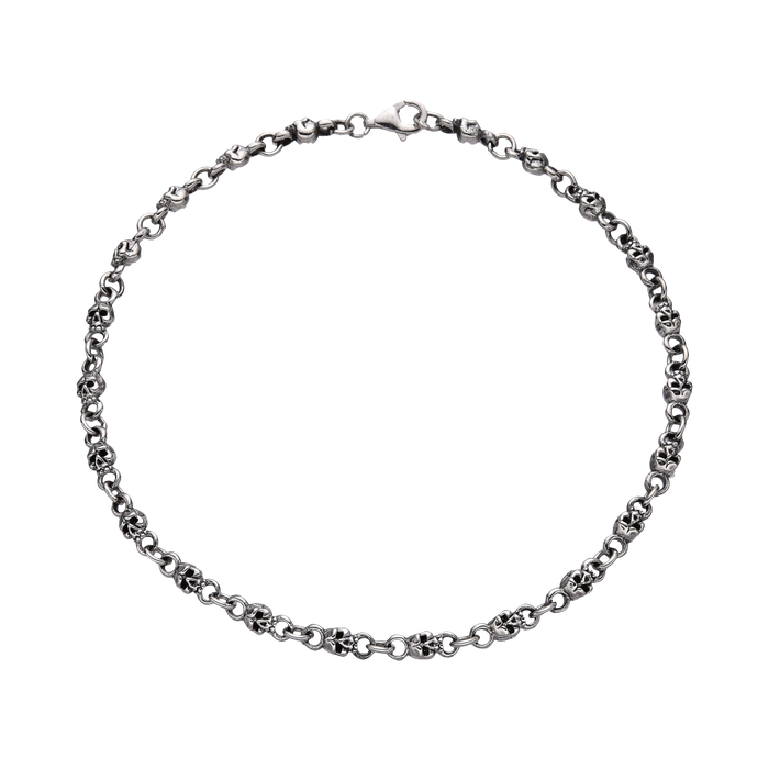 [full] - Sterling silver skull link bracelet with oxidised details and polished highlights.
