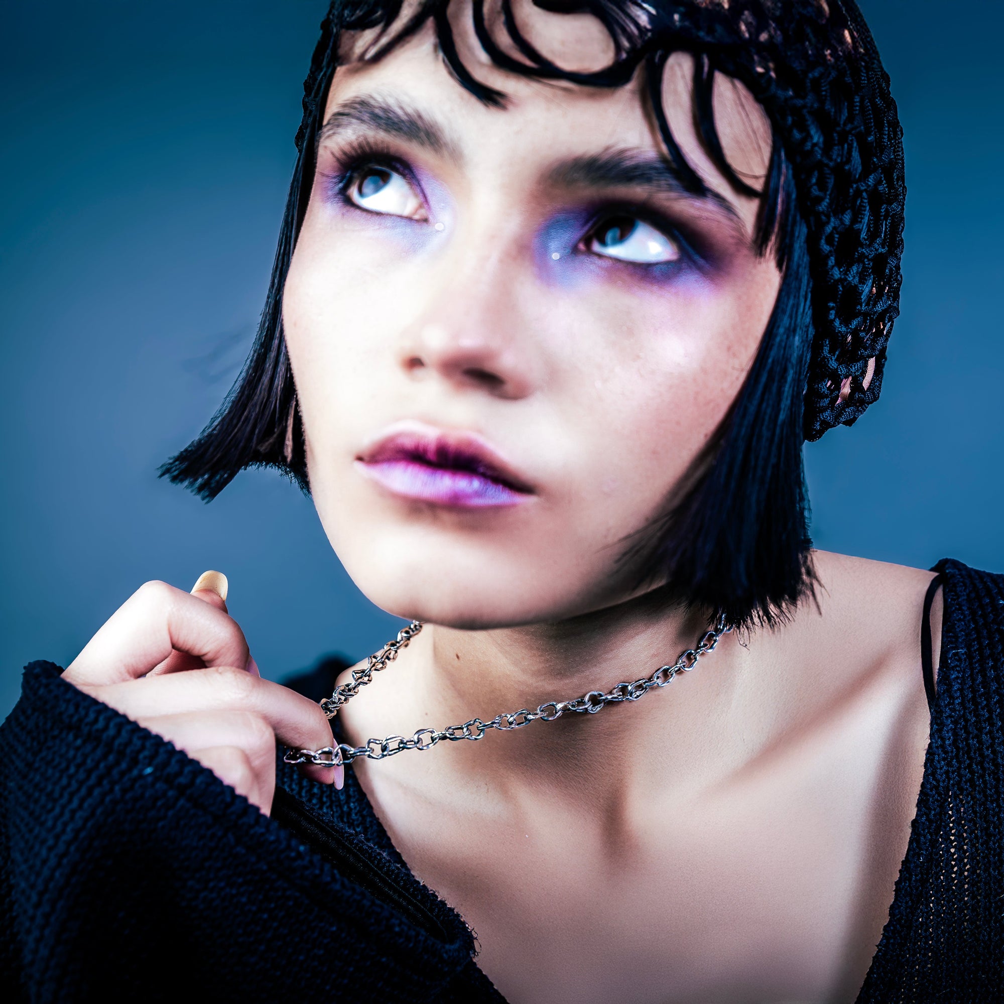 [full] - Woman wearing a silver necklace