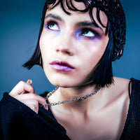 [full] - Woman wearing a silver necklace