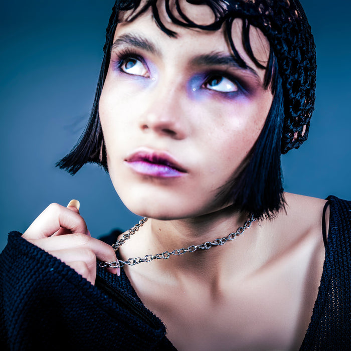 [full] - Woman wearing a silver necklace