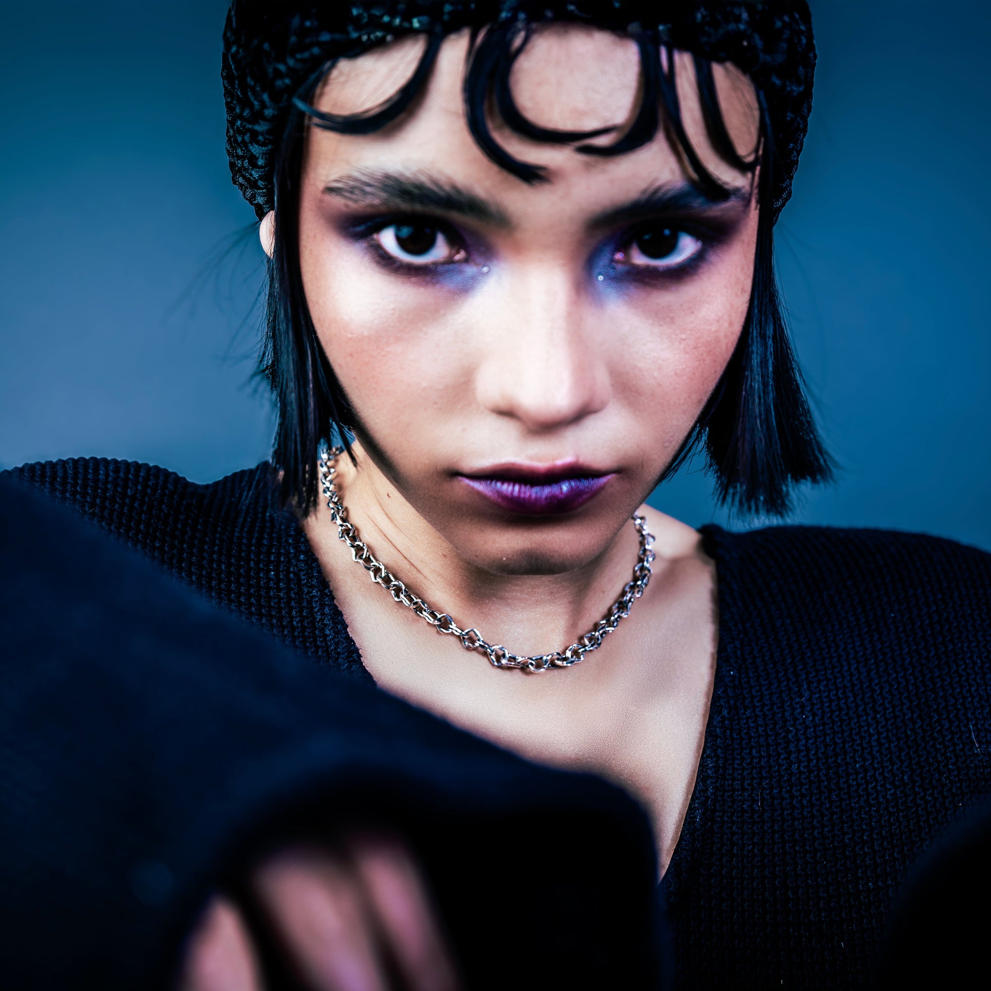 [full] - Woman wearing a silver necklace