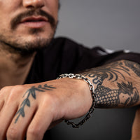 [full] - Close-up of sterling silver bracelet with ruthenium-plated links and brushed gun-metal texture.