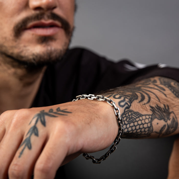 [full] - Close-up of sterling silver bracelet with ruthenium-plated links and brushed gun-metal texture.