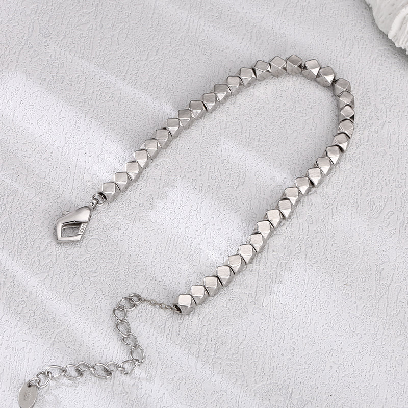 [full] - Faceted sterling silver beads bracelet with geometric design and polished finish.
