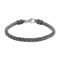 [full] - Braided sterling silver bracelet with oxidised finish and ornate end caps.