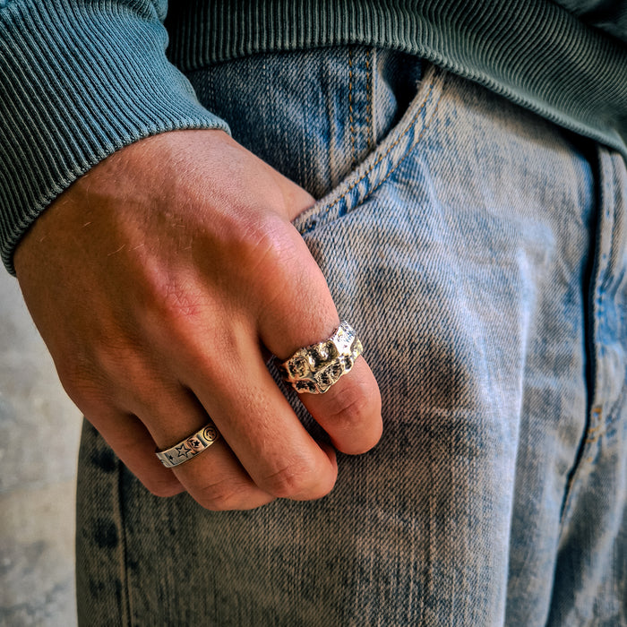 [full] Rugged handmade sterling silver rings, featuring a crater-like texture and stars, happy face motifs